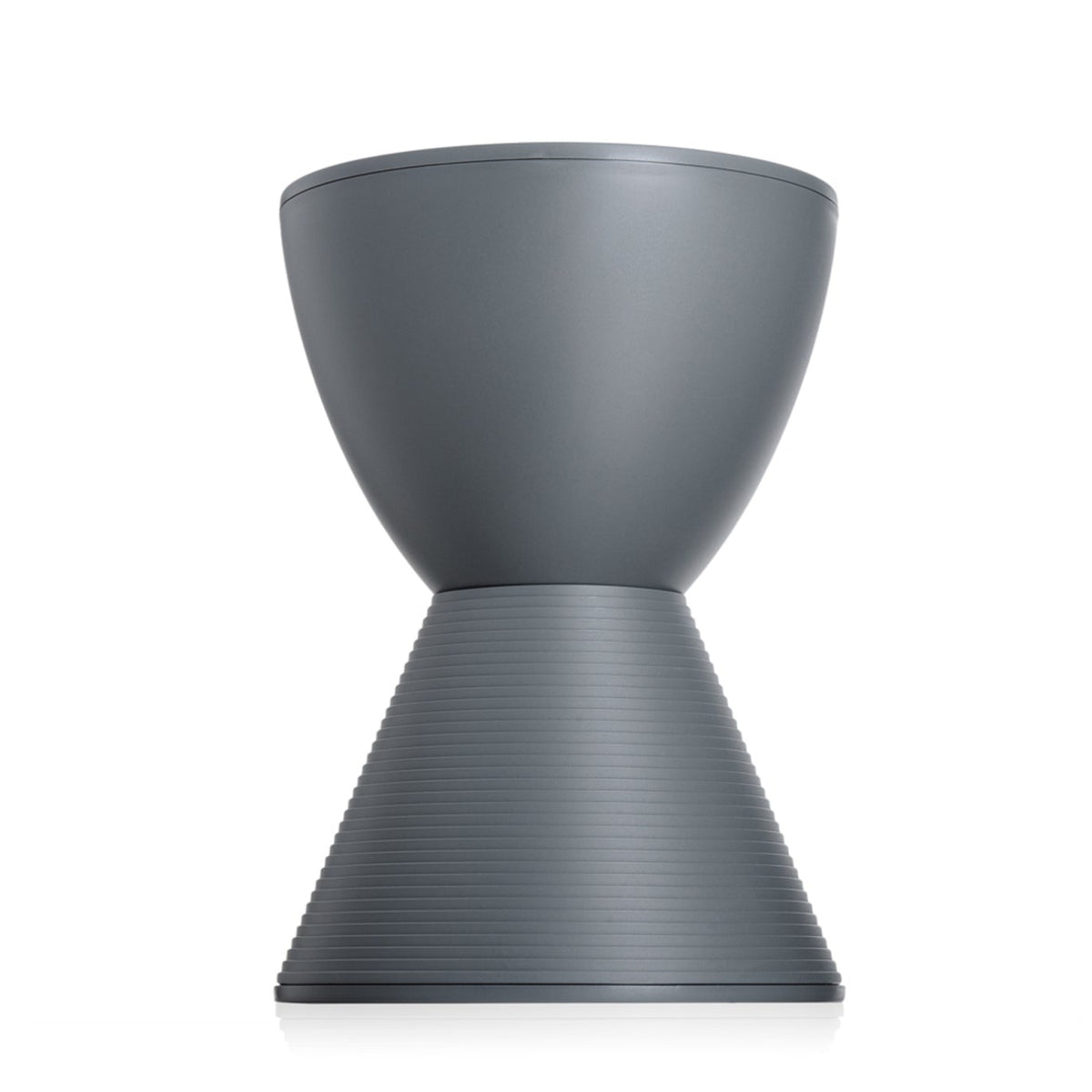 The Kartell Prince Aha Stool, featuring a modern hourglass shape in gray with a smooth top and ribbed lower half, can also be used as a versatile side table and is shown elegantly displayed on a white background.