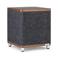 The Ruark RS1 Subwoofer features a modern dark gray fabric body, wooden top and base, silver legs, and a discreet ruark logo—delivering premium audio quality and powerful bass extension.