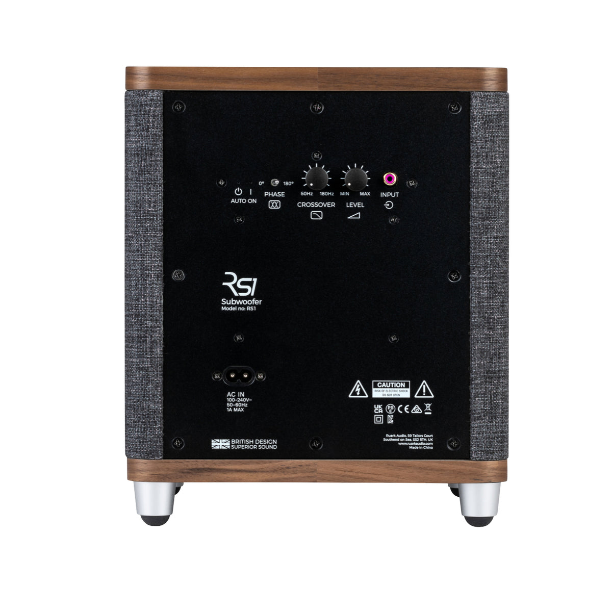 The Ruark RS1 Subwoofer by Ruark features a wood-accented back panel with control knobs, input ports, a power switch, and labels for premium audio and deep bass. It stands on four metal feet.