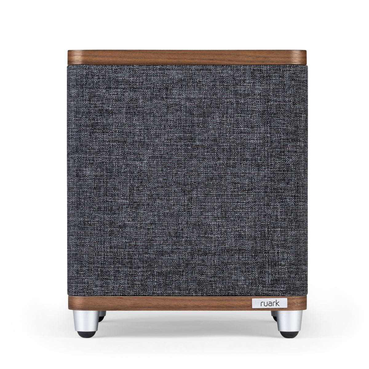 The Ruark RS1 Subwoofer features a rectangular design with a gray fabric front, wooden top and bottom edges, silver legs, and a small Ruark logo on the lower right corner, delivering premium audio and impressive bass extension.