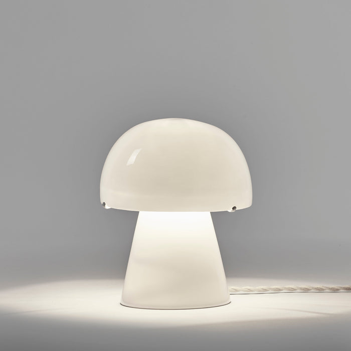 Serax Joe n°1 Table Lamp made of bone china, shaped like a mushroom with a glowing dome shade.