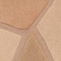 A close-up of a Ligne Roset Bojagi rug, a sculptural hand-tufted design with a stone-like pattern featuring various shades of tan and brown separated by recessed lines.