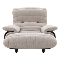 A low-profile Ligne Roset Marsala Armchair, Ella Fabric, upholstered in textured beige fabric with black structural armrests and short black legs.
