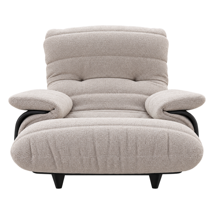 A low-profile Ligne Roset Marsala Armchair, Ella Fabric, upholstered in textured beige fabric with black structural armrests and short black legs.