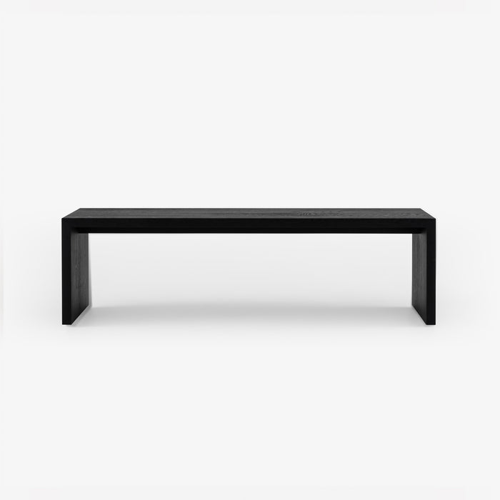 Minimalist black Ex-Display Eaton Dining Bench in Burnt Effect Oak by Ligne Roset with a continuous waterfall leg design.