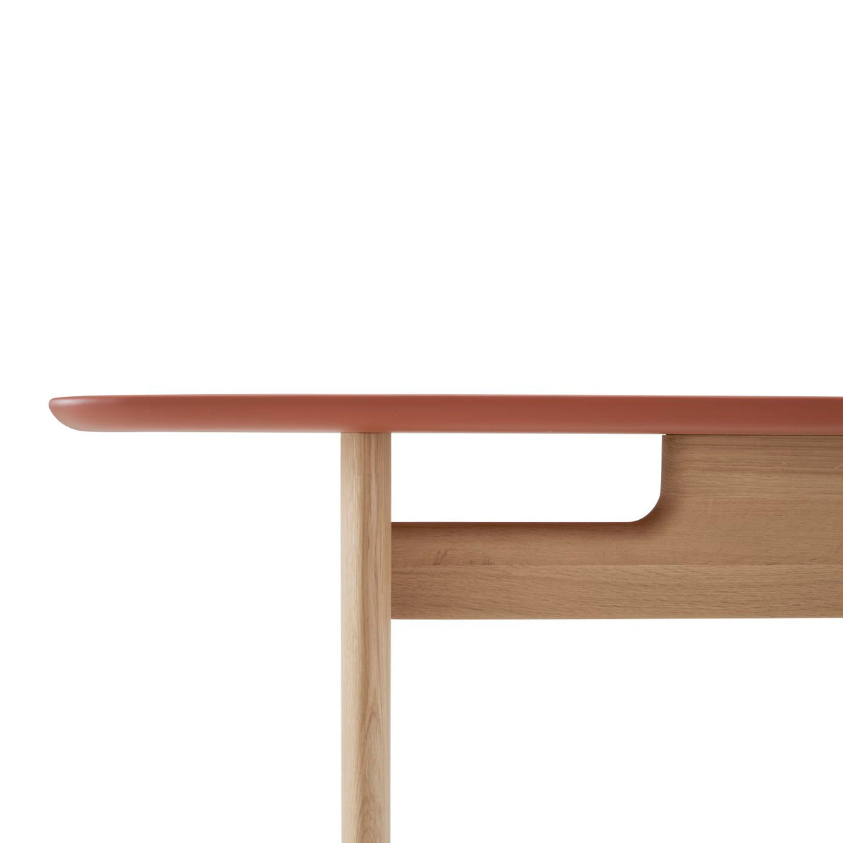 Close-up of an Intervalle Console Table by Ligne Roset with a matte coral-colored top and light solid oak legs and support frame.