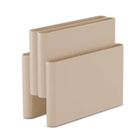 Beige Kartell Magazine Rack with a folded, U-shaped design and multiple compartments in a retro mid-century Italian style.