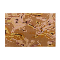 A rectangular, hand-tufted Ligne Roset Kimono Rug in New Zealand wool featuring an abstract, organic pattern in shades of brown, tan, and soft pink.