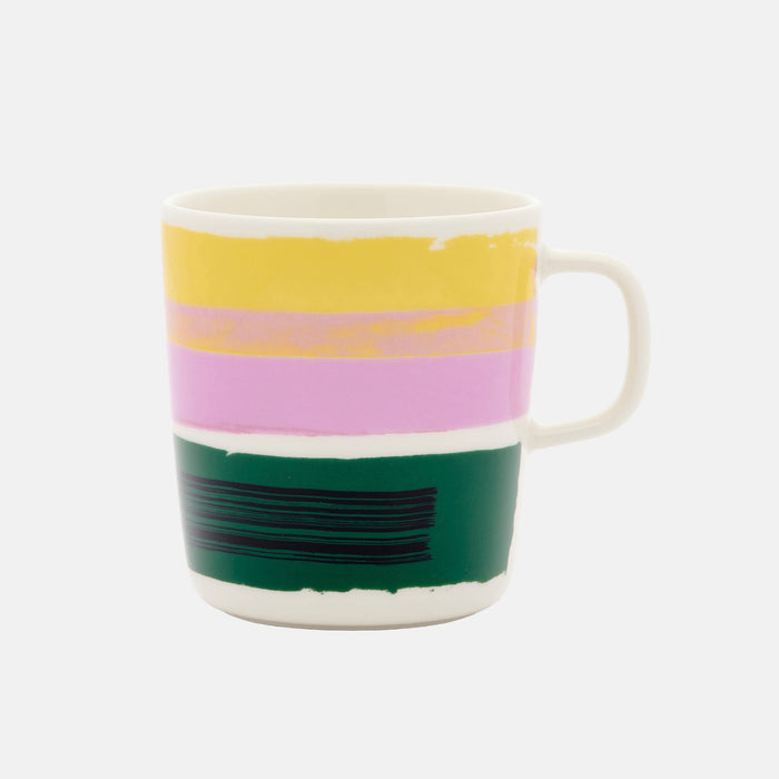 The Marimekko Daily Variations Mug 4dl is a white ceramic mug featuring horizontal stripes in yellow, pink, green, and black. Designed to complement contemporary home decor and inspired by Marimekko’s Daily Variations collection, the mug includes a right-side handle and is displayed against a plain white background.