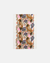 The Ketunmarja Kitchen Towel by Marimekko showcases a white cotton-linen fabric adorned with a vertically repeating pattern of brown birds, blue leaves, orange berries, and pink circles. This eye-catching towel brings a fresh twist to your Marimekko Christmas Edition décor.