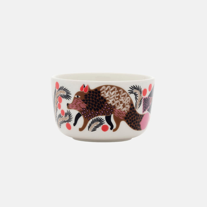 The Marimekko Oiva / Ketunmarja Bowl 2,5dl is a white ceramic bowl featuring a stylized illustration of a brown hedgehog surrounded by black and pink plants and berries on a plain white background. Inspired by the classic Ketunmarja design, this festive tableware piece perfectly complements the Marimekko Christmas Edition collection.