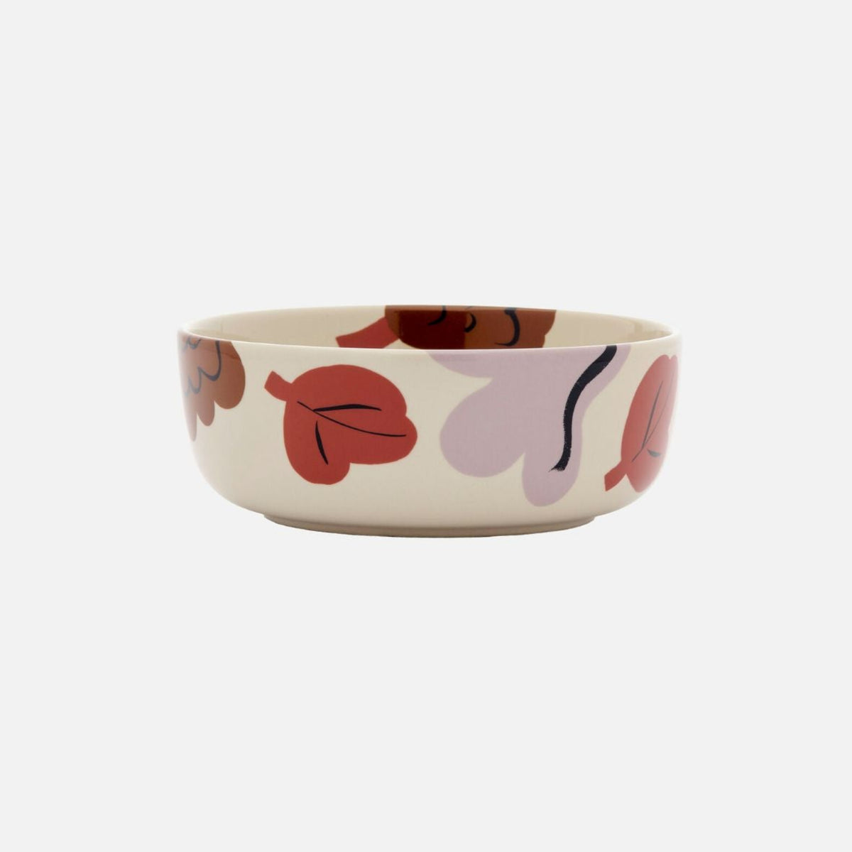 The Marimekko Kukasta Kukkaan Bowl 4dl is cream-colored and features red, pink, and brown leaf-shaped patterns around the outside, capturing the brand’s iconic style. It is shown against a plain white background.