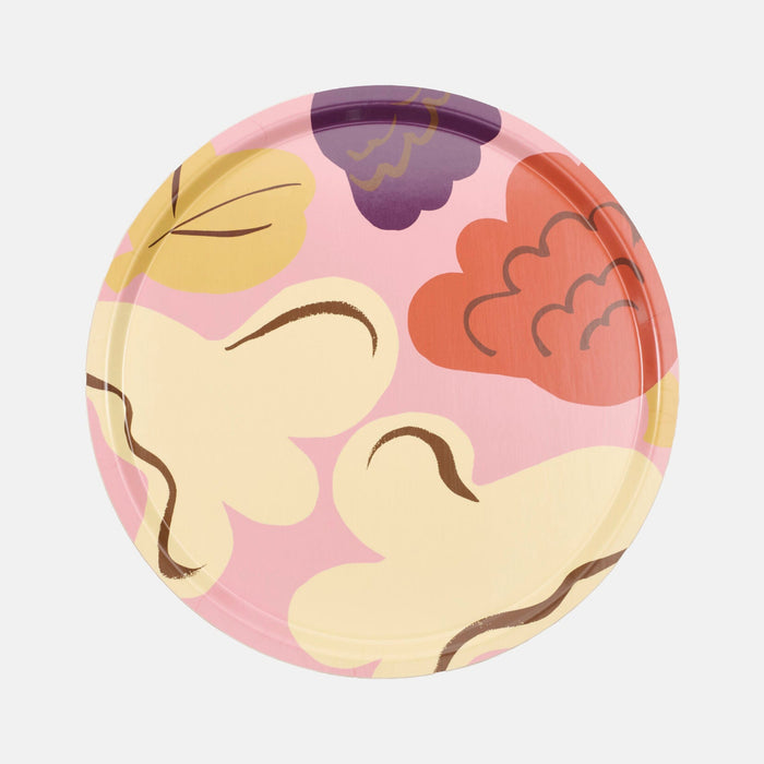 The Marimekko Kukasta Kukkaan Tray is a round birch plywood tray featuring a pink background adorned with abstract yellow, red, purple, and brown shapes reminiscent of clouds or leaves—perfect for infusing your table setting with signature Marimekko style.