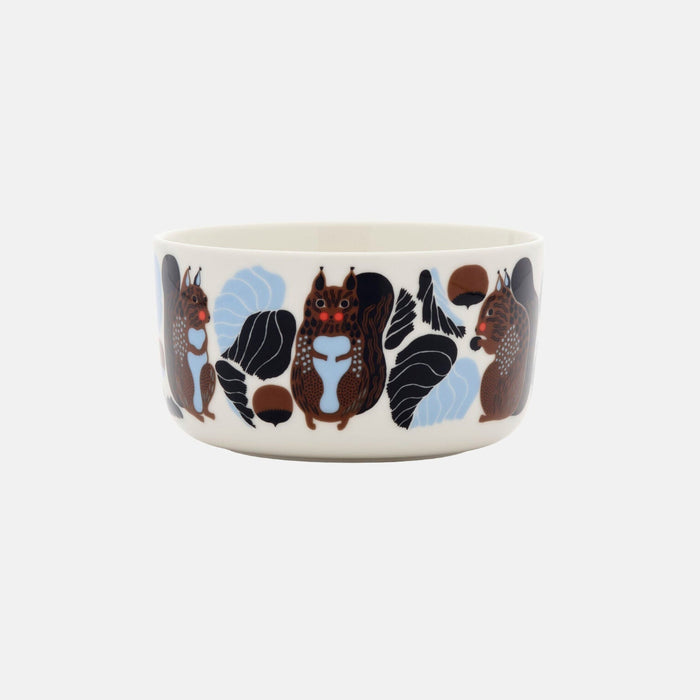 Introducing the Marimekko Oiva / Kurre Bowl 5dl—a ceramic bowl adorned with a forest-inspired pattern of illustrated brown squirrels, blue leaves, and acorns encircling a crisp white background. Ideal for adding to your Christmas Edition 2026 collection.