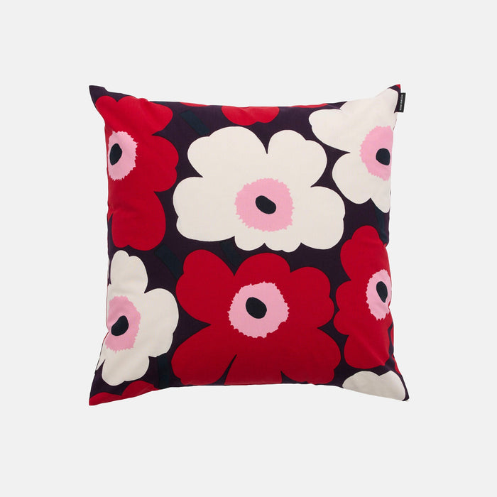 Add a burst of color to your space with the Marimekko Pieni Unikko Cushion Cover. Featuring a bold floral pattern in vibrant red, white, and pink on a dark background, this square cushion cover showcases simple flower shapes with round centers and playful petal designs. Made from 100% cotton for lasting comfort and style, it’s the perfect accent to brighten any room.