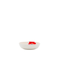 The Marimekko Oiva / Unikko Serving Dish is a small, white, shallow bowl featuring a red and blue floral design on the inside, centered against a crisp white background.