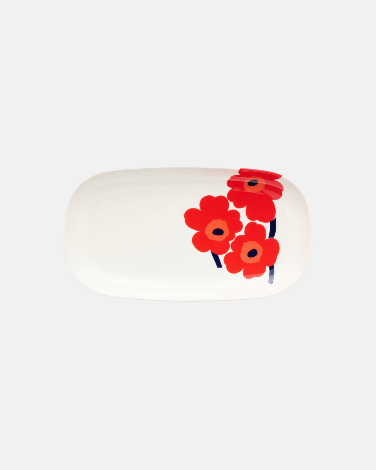 The Marimekko Oiva / Unikko Serving Dish is a white oval dish featuring a bold floral design with three red Unikko poppy flowers and dark stems on one side, set against a simple light background.