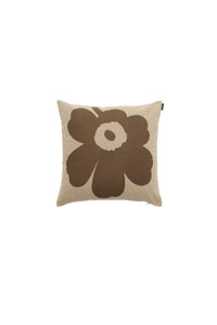 The Marimekko Unikko Cushion Cover is a square beige cushion cover made from recycled cotton, showcasing the brand’s signature large dark brown floral pattern with a small cream circle at the center of the flower, all set against a plain white background.
