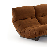 Brown textured Ligne Roset Marsala Medium Sofa in Parade fabric, featuring a low-profile curved design and a dark wooden base.