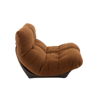 Brown tufted Ligne Roset Marsala Medium Sofa in Parade fabric with a dark curved frame.