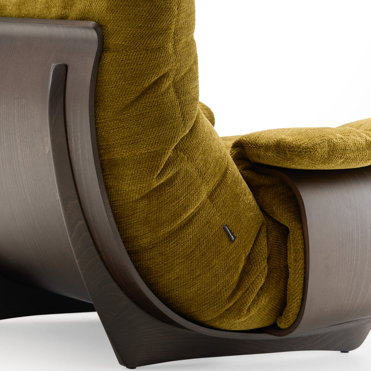 An olive green chenille upholstered Marsala Armchair in Festa fabric with a curved, dark wood frame.