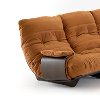 A brown tufted Soft Touch leather Marsala 3-Seat Sofa with a curved dark wood side panel.