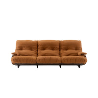 A Ligne Roset Marsala 3-Seat Sofa, Soft Touch Leather in rust brown with tufted cushions and dark wooden legs.
