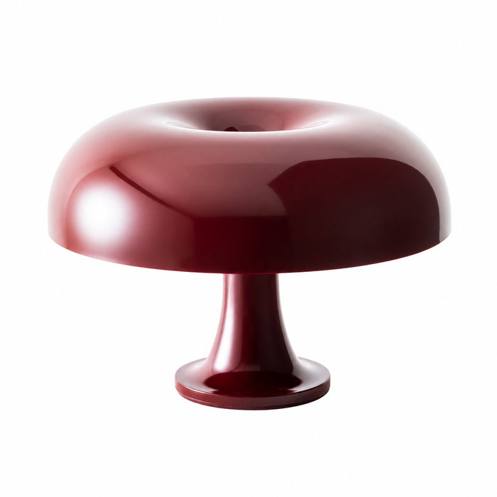 The Artemide Nessino Table Lamp is a modern lighting piece featuring a glossy, deep burgundy finish with a rounded dome-shaped shade and a short, cylindrical base—perfect for bringing iconic retro charm to any white backdrop.