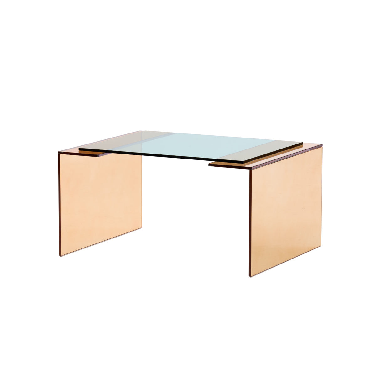 The Patchs Low Table by Ligne Roset features a minimalist, contemporary design with a clear, green-tinted tempered glass top and two flat rectangular rose-gold side panels that serve as legs. Its clean lines and sleek appearance embody modern elegance.