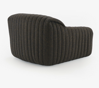 The Sandra Armchair, Vanir by Ligne Roset is a modern, low-profile retro lounge chair with dark ribbed upholstery and rounded edges, shown from the back and side against a plain white background.