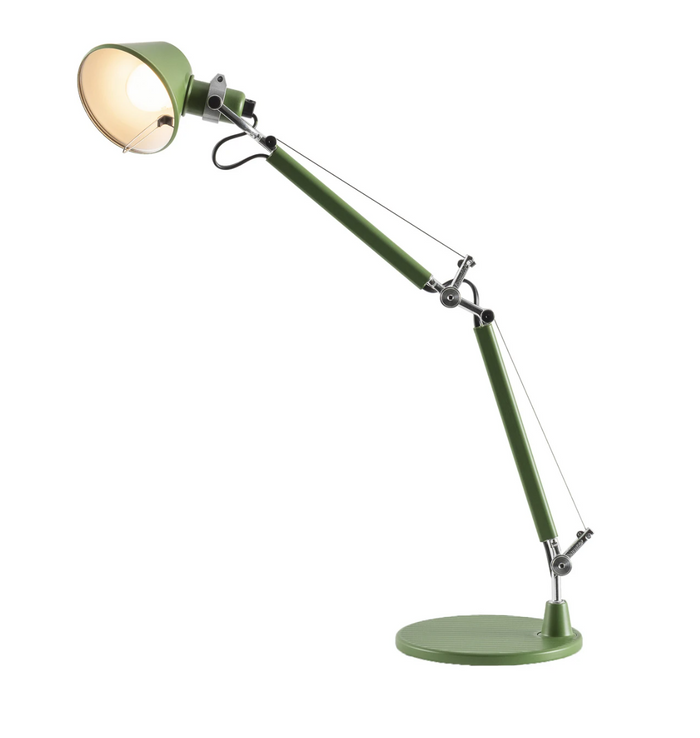 The Artemide Tolomeo Micro Desk Lamp in green features a round base, angled adjustable arm, visible metal joints, and tension cables—hallmarks of the brand’s iconic desk lamp design—casting a warm light.