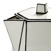 A close-up of the Carte Blanche Teapot by Serax—a geometric, white fine bone china teapot distinguished by sharp angles, bold black outlines, and a hexagonal lid and spout.