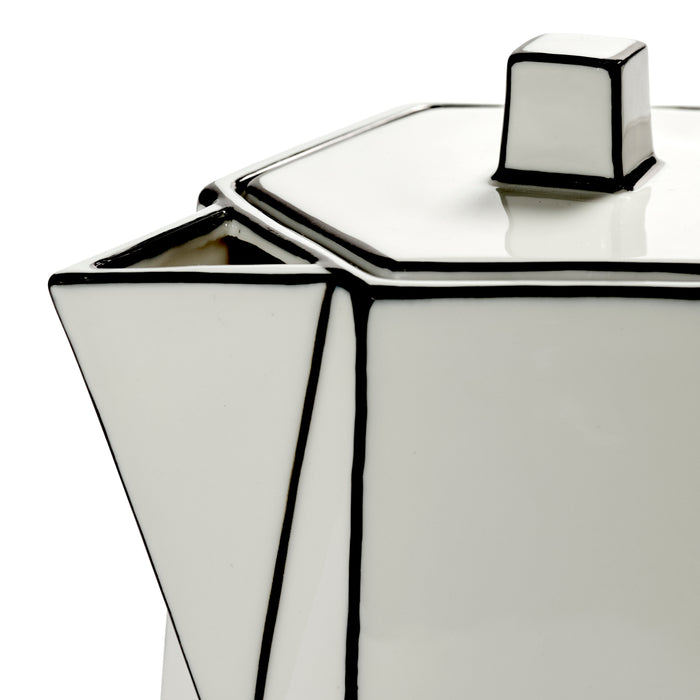 A close-up of the Carte Blanche Teapot by Serax—a geometric, white fine bone china teapot distinguished by sharp angles, bold black outlines, and a hexagonal lid and spout.