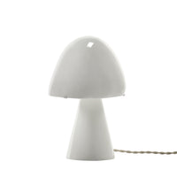 The Serax Joe n°2 table lamp is a mushroom-shaped white light featuring a wide, rounded shade and a tapered base.