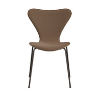 A modern, brown armless Series 7 Chair by Fritz Hansen, front upholstered in technicolor fabric and inspired by Danish design, features a curved backrest and seat reminiscent of Arne Jacobsen’s iconic aesthetic, supported by four slender black metal legs and displayed against a white background.