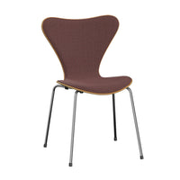 Experience the iconic Series 7 Chair, Front Upholstered in Technicolor Fabric by Fritz Hansen—a modern design featuring a curved seat and backrest with rich, dark brown upholstery, light wood trim accents, and slender metal legs. Taking inspiration from Danish classics by Arne Jacobsen, this chair offers a simple yet contemporary aesthetic perfect for dining or office settings.