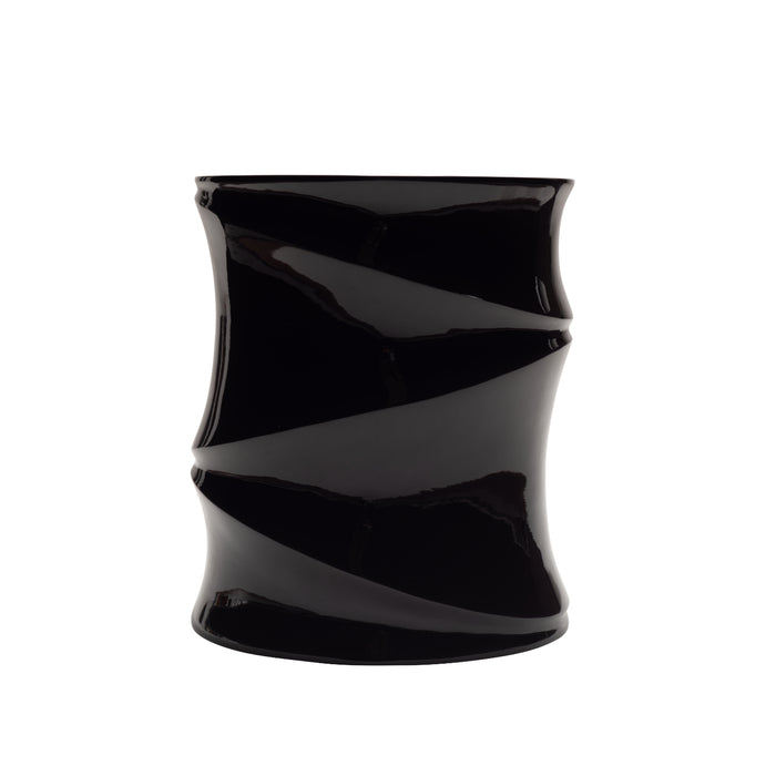 A glossy black cylindrical occasional table named the Simeti, featuring a striking twisted, spiral design by Ligne Roset. Handcrafted in Vietnam with a stunning glossy lacquer finish, it is showcased against a plain white background.