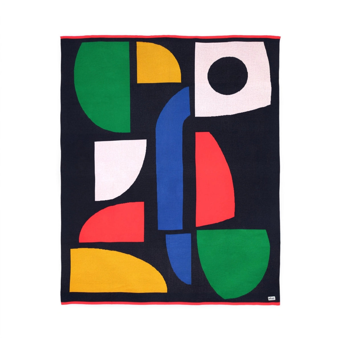 Sophie Home Bruten Throw with a black background and an abstract pattern of colorful geometric shapes.