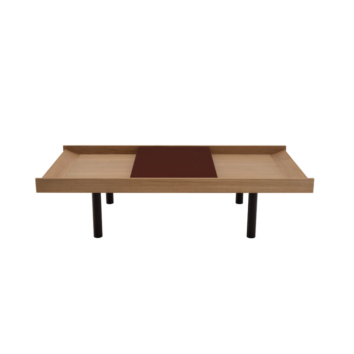 Ligne Roset Tray Low Table featuring a low rectangular oak-veneered surface with a raised edge, a flat dark center panel, and four cylindrical black legs.