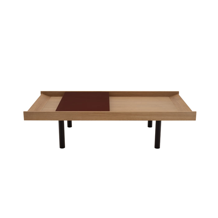 Ligne Roset Tray Low Table, a low rectangular oak-veneered coffee table with a raised edge, a dark rectangular inlay on its surface, and four dark cylindrical legs.