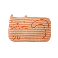 Introducing the Donna Wilson Ginge Cat Hot Water Bottle, a rectangular orange cushion with horizontal stripes and a simple cat face and tail design. Made in the UK, this charming accessory features two small ears at the top, reminiscent of a cozy lambswool hot water bottle.
