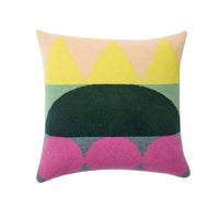 Donna Wilson’s Totem Large Square Cushion - Green: Crafted in the UK, this spacious lambswool pillow features an abstract geometric design with bold yellow triangles at the top, a striking green half-circle in the center, and playful pink semicircles at the bottom, all set on a light background. Perfect for adding a modern touch to your home décor.
