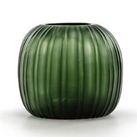 The Erongo Vase by Guaxs is a round, dark green mouth-blown glass vase with vertical ridges, showcasing handmade artistry against a white background.