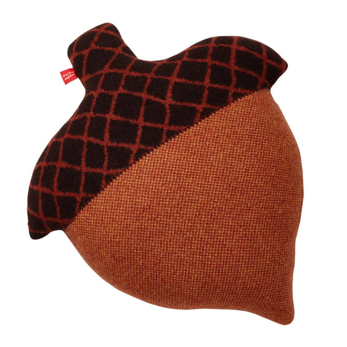 The Acorn Shaped Cushion by Donna Wilson is a decorative pillow crafted in Scotland from soft lambswool. Shaped like an acorn, it features a textured brown bottom, a darker brown top with a crisscross pattern, and is finished with a small red tag on one side.
