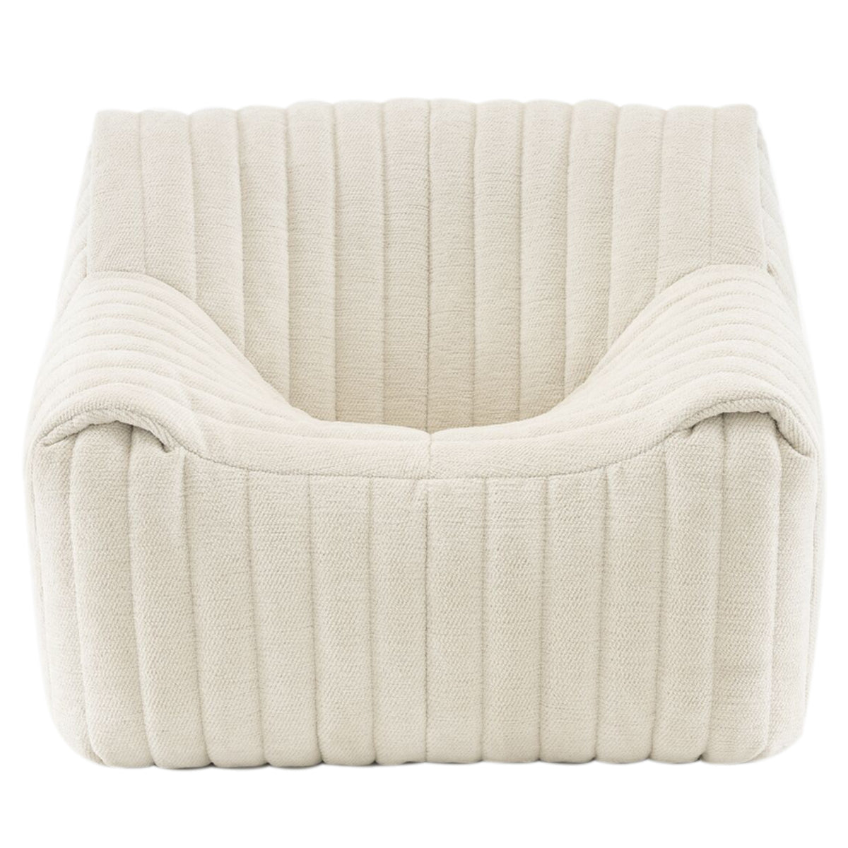 The Sandra Armchair, Vidar by Ligne Roset features a modern square design in cream with ribbed upholstery and deep cushioning, offering luxury comfort and a chic retro lounge vibe.