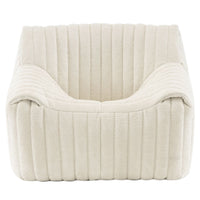 The Sandra Armchair, Vidar by Ligne Roset features a modern square design in cream with ribbed upholstery and deep cushioning, offering luxury comfort and a chic retro lounge vibe.