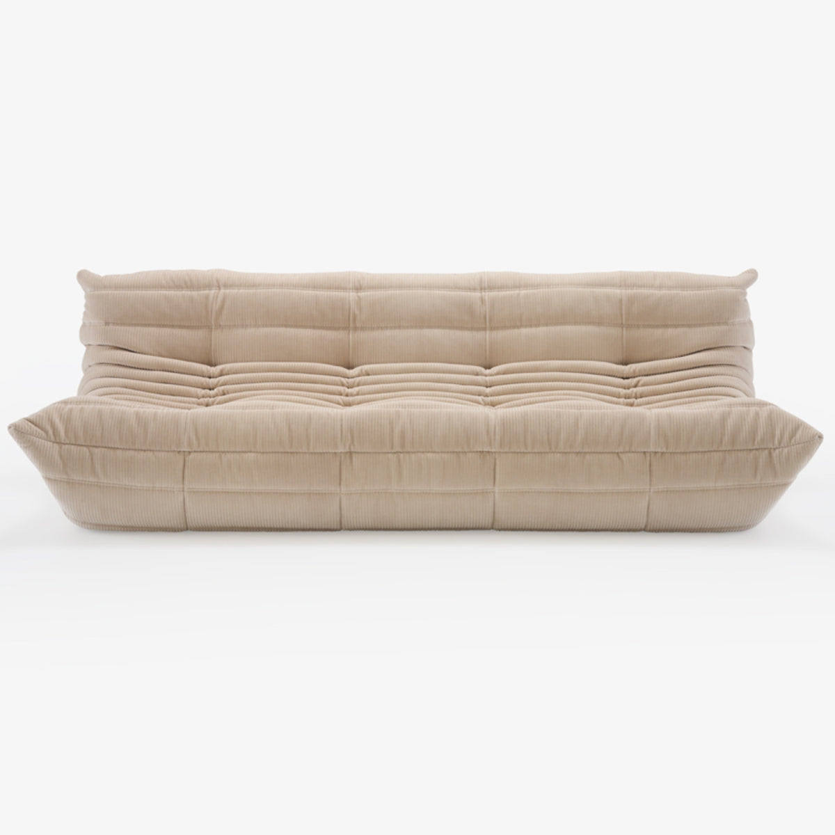 A modern, plush beige Togo Very Large Sofa by Ligne Roset, crafted in Phlox fabric and inspired by Michel Ducaroy’s iconic design, featuring deep horizontal and vertical tufting, a low-profile silhouette, and overstuffed cushions—shown here on a white background.