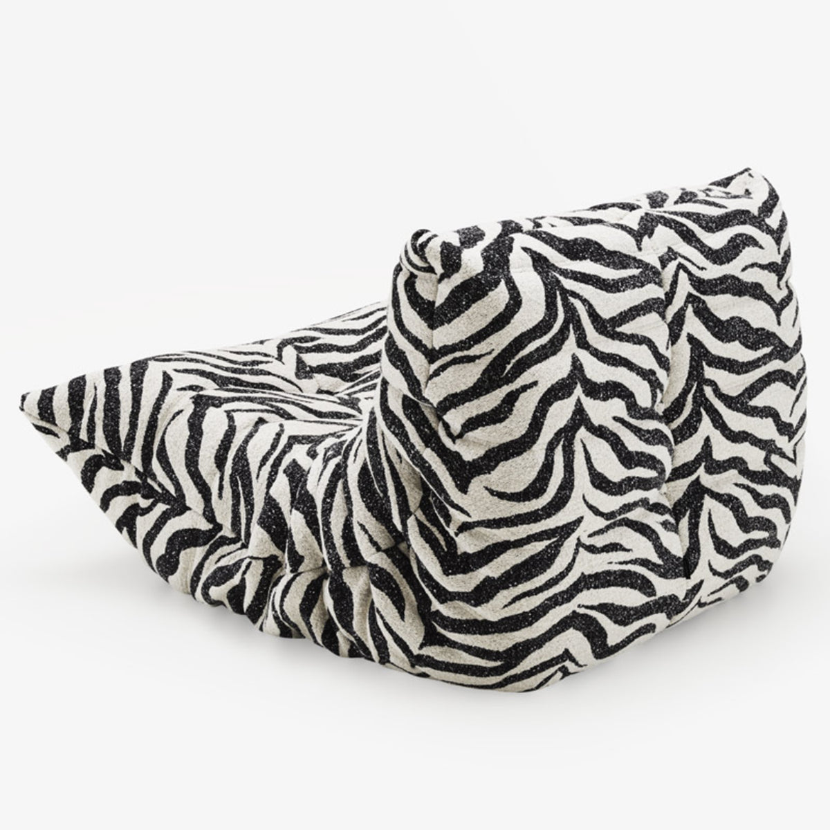 The Togo Fireside Chair, Tablu by Ligne Roset is showcased on a plain white background, featuring a low, slouchy silhouette with bold black and white zebra-print stripes and a soft, textured surface reminiscent of the iconic Togo lounge chair design.