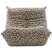 Togo Fireside Chair, Tablu by Ligne Roset—a low lounge chair with a plush, ruched silhouette reminiscent of the iconic Togo design, featuring beige and black leopard print upholstery, shown from the front against a white background.