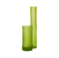 Two tall, cylindrical Guaxs Tube Vases in light green glass, featuring a textured surface, stand side by side on a white background—one is shorter and wider, the other taller and slimmer.